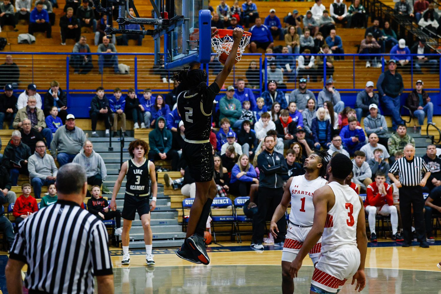 Link Academy's Jasper Johnson throws down a dunk